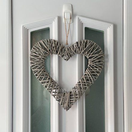  Sure to bring a sweetheart feature to any home space, a large sized hanging heart frame wrapped in a grey toned wicker 