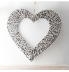  A extra large decorative hanging wicker heart with a cut out centre and soft grey tone to finish 