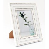 A wooden looking picture frame set with a distressed painted finish and antique look 