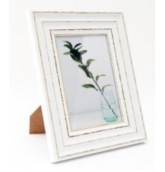 A large antique inspired picture frame with an overly distressed painted finish and large 5x7in picture space 
