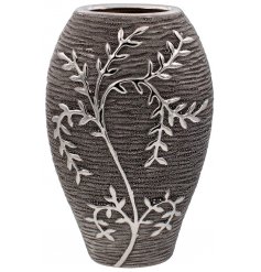  A Gun Metal Grey toned ceramic ornamental vase featuring an embossed climbing leaf decal 