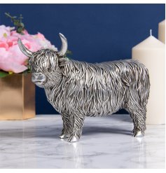 A standing ornamental Highland Cow in a Rustic Silver Tone 
