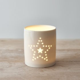 Decorated with a dotted Star decal, this small ceramic candle pot is sure to bring a cosy glow to any home space 