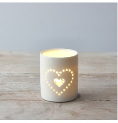  Set with a dotted heart text decal, this simple themed ceramic candle holder is a must have for any home 
