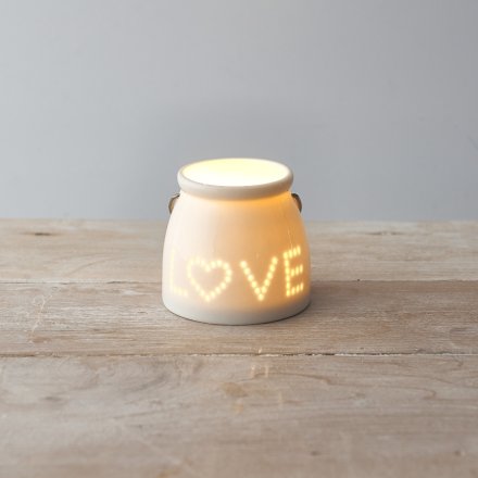  Perfect for adding a hint of coziness within in any home space, a small T-light holder with a dotted love text decal 