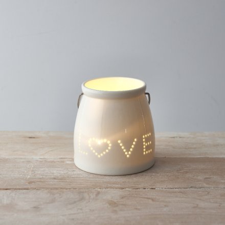 A small ceramic tlight featuring a sleek white tone and pierced dotted LOVE text decal to the front 
