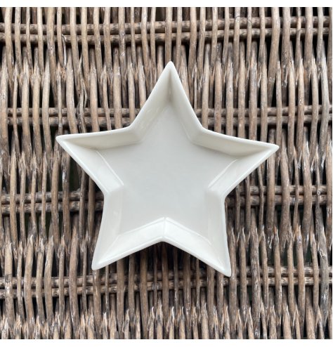 A small and simple star shaped ceramic dish, suitable for trinkets and decor in your home 