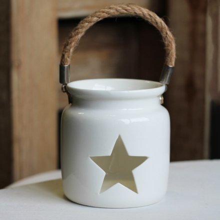 A simplistic White Ceramic T-Light Holder in Cut Out Star Design
