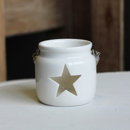 A sweet and simple white toned ceramic tlight holder set with a chunky rope handle and star cut window 