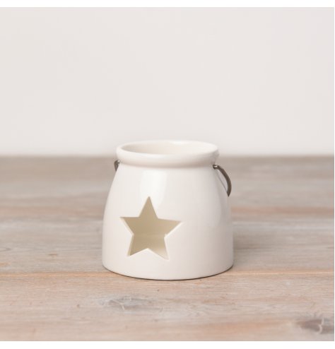 A Small tlight holder with a star cut decal 