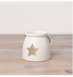  A ceramic T-light holder set in a sleek white tone, complete with a wide star cut decal 