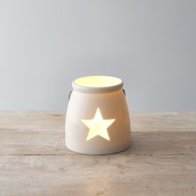  A ceramic T-light holder set in a sleek white tone, complete with a wide star cut decal 