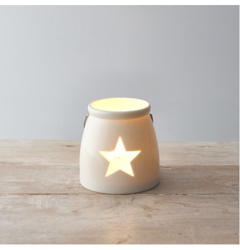A Small tlight holder with a star cut decal 