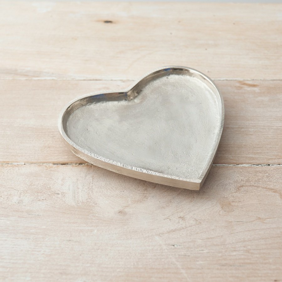 An overly distressed silver heart plate, a perfect little ornament to add to your home 