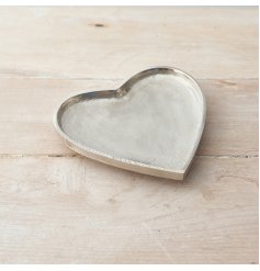 An overly distressed silver heart plate, a perfect little ornament to add to your home 