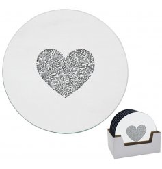 A small round candle plate featuring a mirrored effect and glitzy crystal heart centre