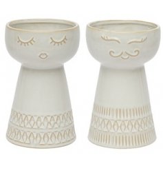 Assorted by their facial accents, these tall decorative vases are a must have for any Neutral themed home space 