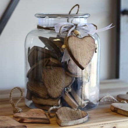  A mix of 36 natural wooden heart shaped tokens, perfectly preserved in a glass jar 