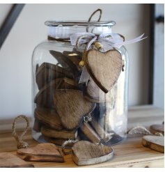  A mix of 36 natural wooden heart shaped tokens, perfectly preserved in a glass jar 