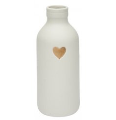 A small decorative vase in a basic white tone, perfectly complete with a natural toned heart decal 