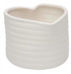 A small heart shaped planter with a ribbed edge finish 