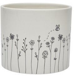  A charming and sweetly themed Ceramic coastersPlanter with a white base tone 