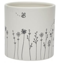  A charming and sweetly themed Ceramic Planter with a white base tone 