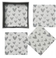 A sleek and stylish set of Ceramic Coasters, each decorated with a grey heart motif detail 