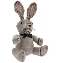 A sitting Rabbit Doorstop set with a soft grey faux leather tone and finished with added faux fur trimmings 