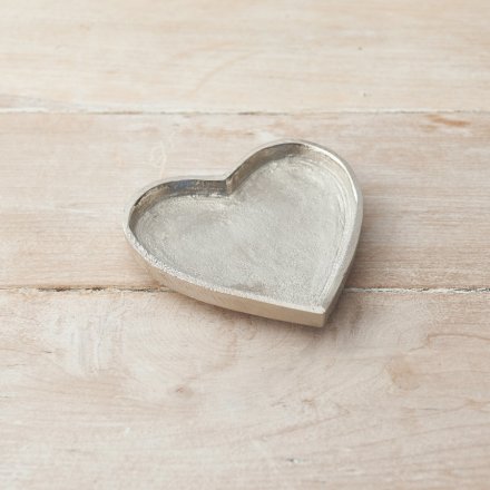  A small aluminium heart shaped trinket plate with an overly distressed finish 