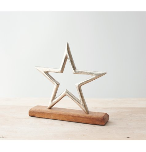 A Silver Star Design on a Natural Wooden Base