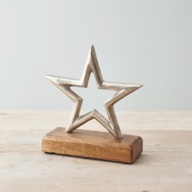 A natural wood block based ornament with a textured metal star to feature