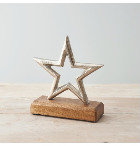 A Charming Metal Star on a Wooden Base