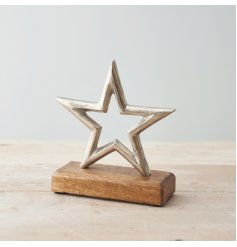 A natural wood block based ornament with a textured metal star to feature