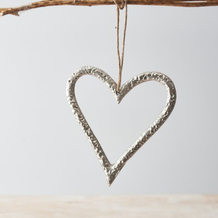 A stylish and unique silver hanging heart decoration. Complete with a textured surface and jute hanger.