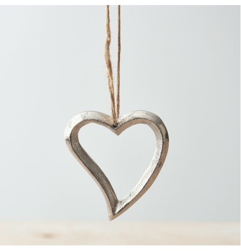 A chunky metal heart hanger with a chic textured finish and rustic jute string hanger.