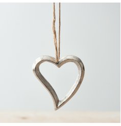 A chic silver hanging heart decoration. Details include a textured finish and rustic jute string hanger.