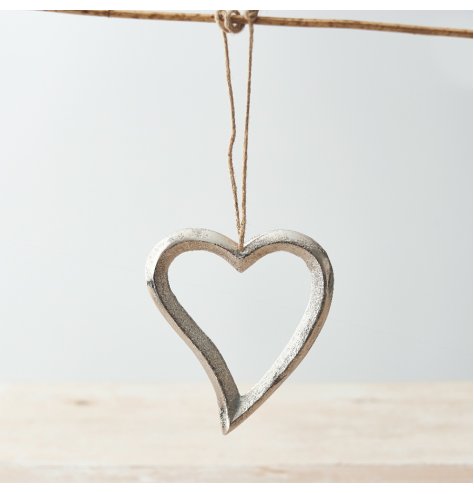 A charming metal hanging heart decoration with plenty of character. Complete with a jute string hanger