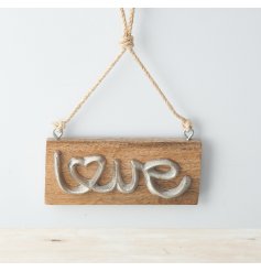 A charmingly rustic inspired hanging wooden plaque featuring a distressed metal scripted text decal 