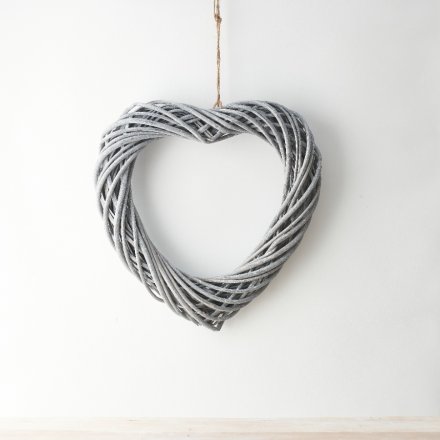 A stylishly simple woven wicker heart shaped wreath, set with a trending grey toned finish 