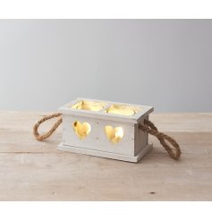 A rustic wooden tray set with heart cut decals, chunky rope handles and spaces for candles