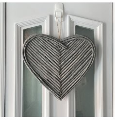  A gorgeous hanging heart decoration made up of natural twigs in a pretty pattern
