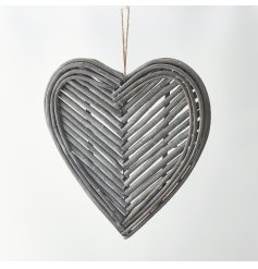 A gorgeous hanging heart decoration made up of natural twigs in a pretty pattern