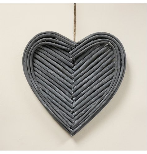 A heart shaped wreath decorated with patterned twigs and a jute string for hanging  Assortment: Single Material: Wood Di