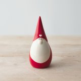 A sweet and simple ceramic gonk with a festive red colour and little heart decal 