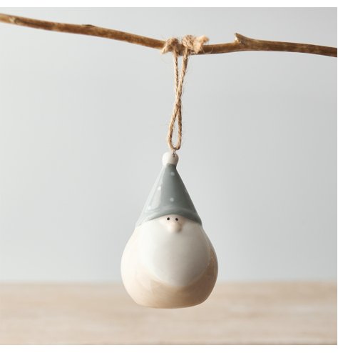 A traditional looking plump ceramic gonk hanger with grey and beige tones complete with a minimalist look 