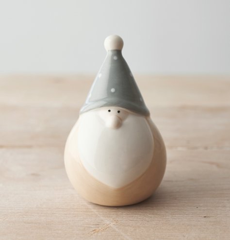 A traditional looking plump ceramic gonk with grey and beige tones complete with a minimalist look 