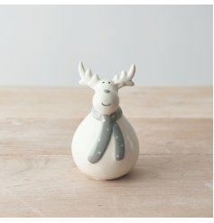 A sweet looking plump ceramic reindeer complete with a smile and grey scarf look 