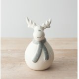 A charming and simple plump looking ceramic reindeer character dressed up in a grey dotted scarf 