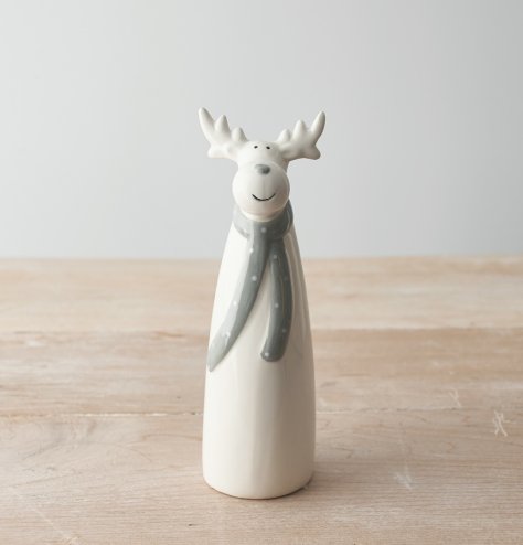 A charming and simple ceramic reindeer character dressed up in a grey dotted scarf 